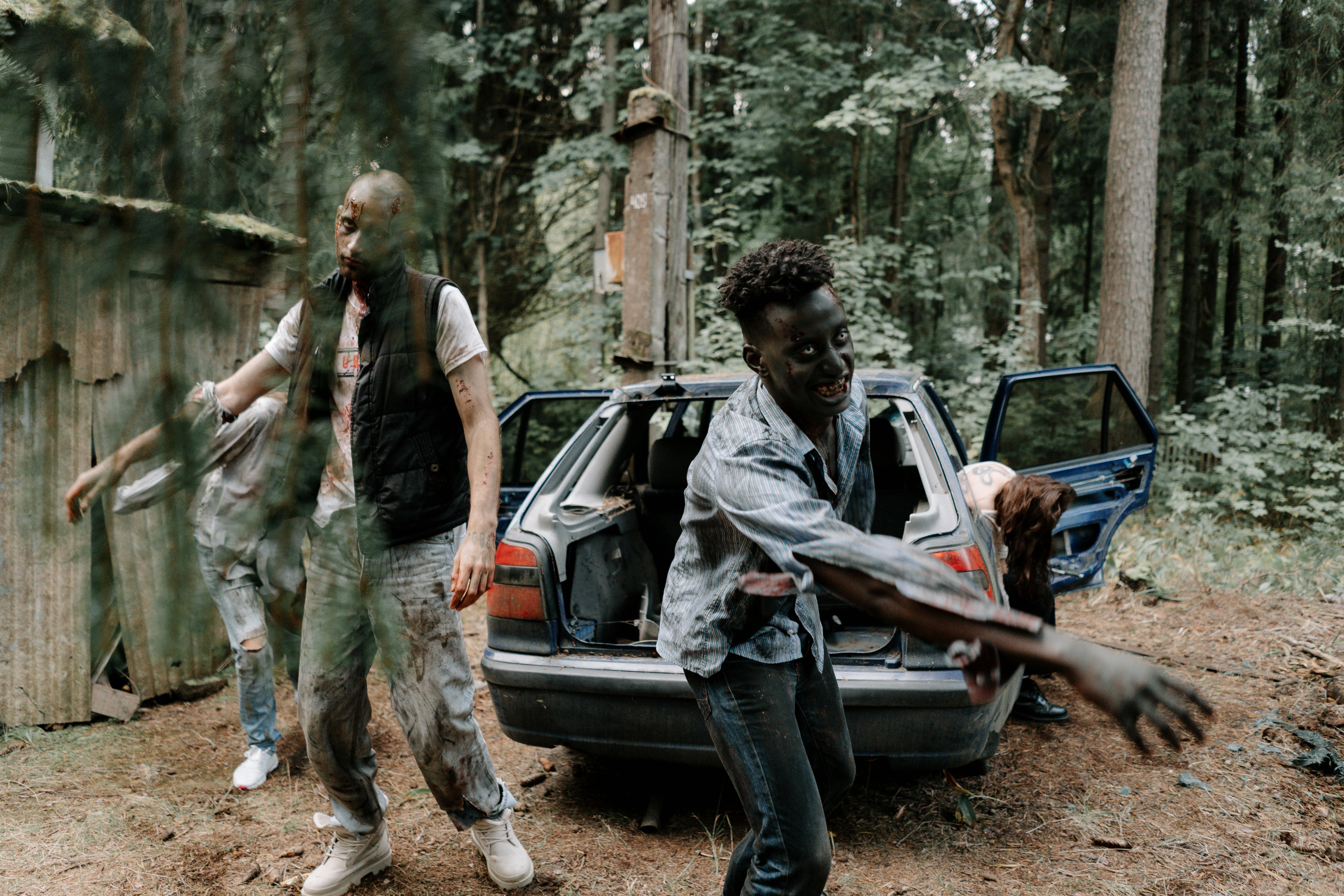 Zombies in front of a car